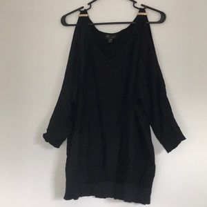 Black sweater with shoulder cut outs.